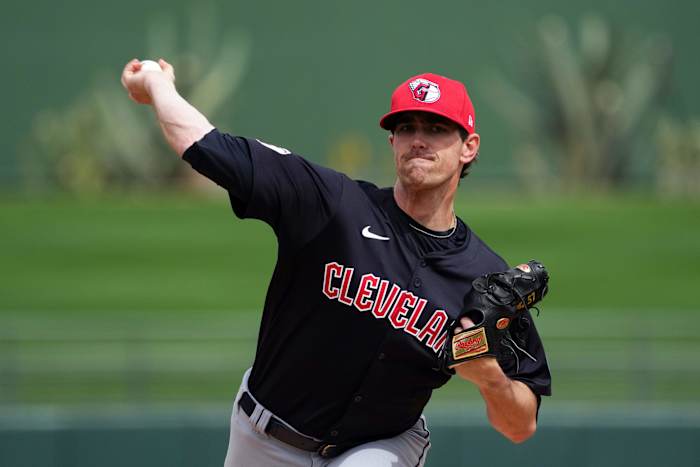 Mar 12, 2024; Surprise, Arizona, USA; Cleveland Guardians starting pitcher Shane Bieber (57) pitches against the Texas Rangers during the first inning at Surprise Stadium.